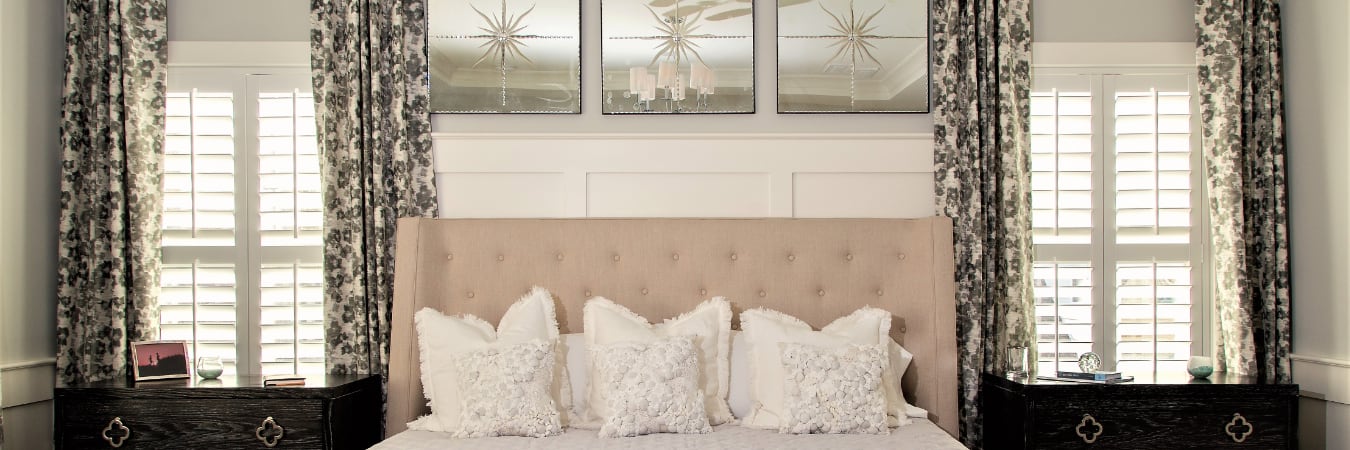 Plantation shutters in a bedroom